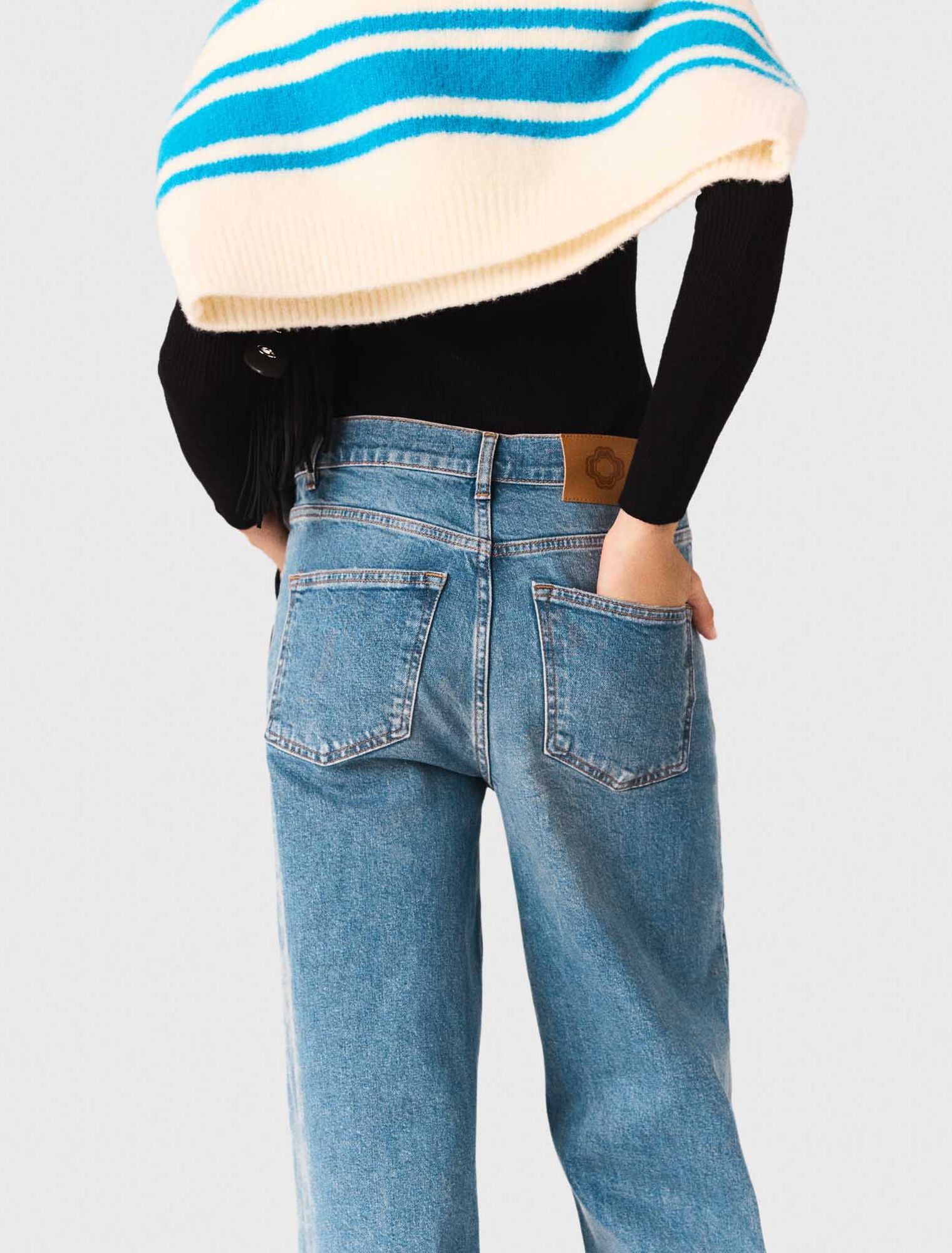 Flared jeans with chain