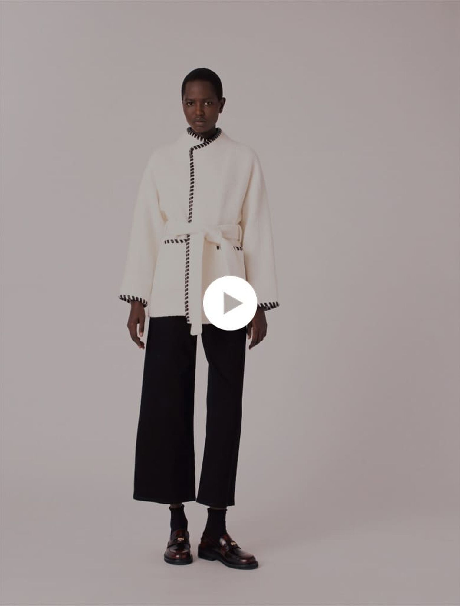 Lined coat with contrasting ribbon