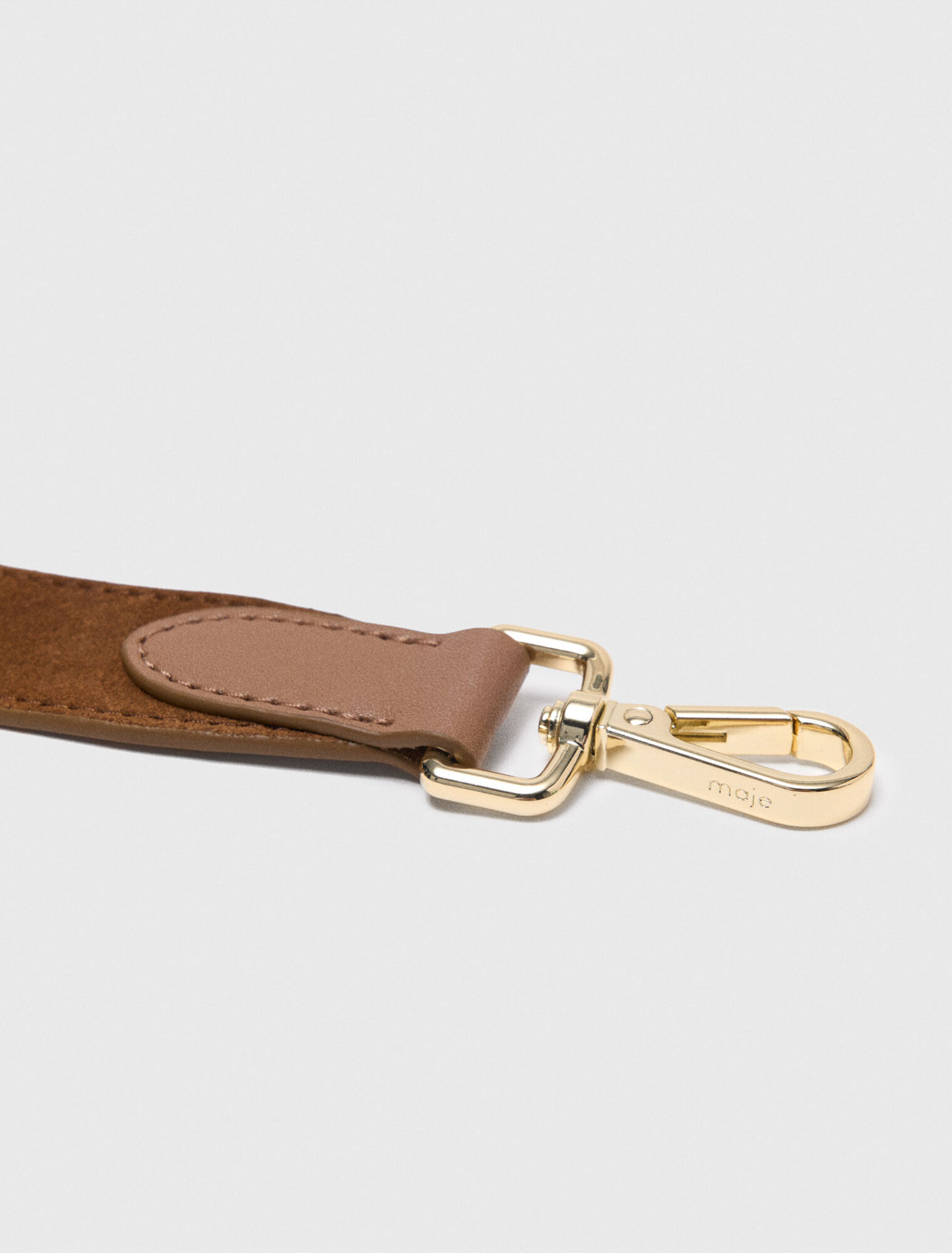 Suede shoulder strap with eyelets