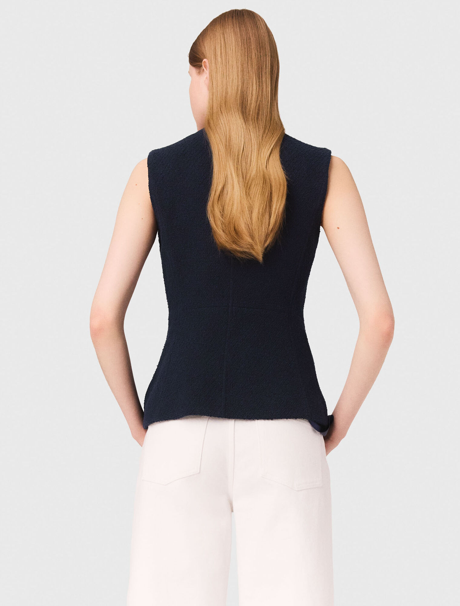 Long sleeveless tweed jacket