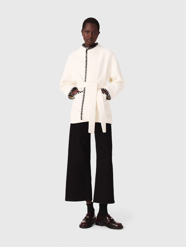 Lined coat with contrasting ribbon Lined coat with contrasting ribbon