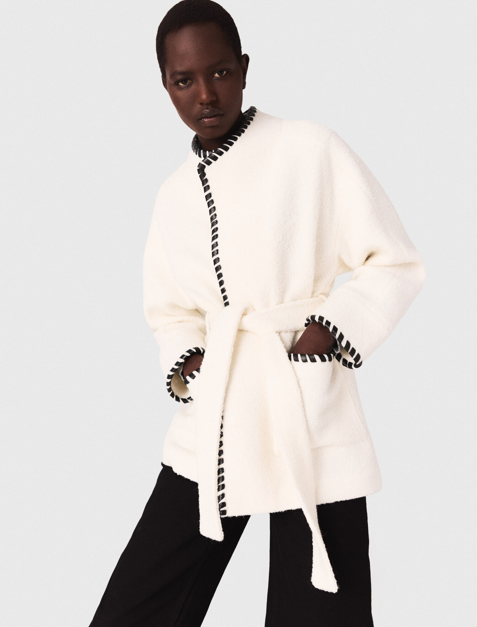 Lined coat with contrasting ribbon