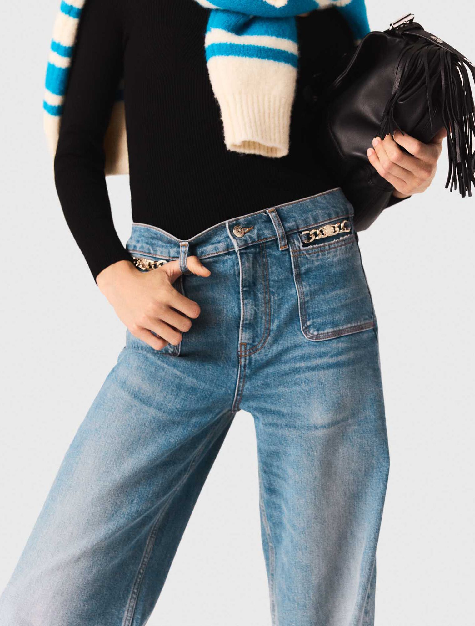 Flared jeans with chain