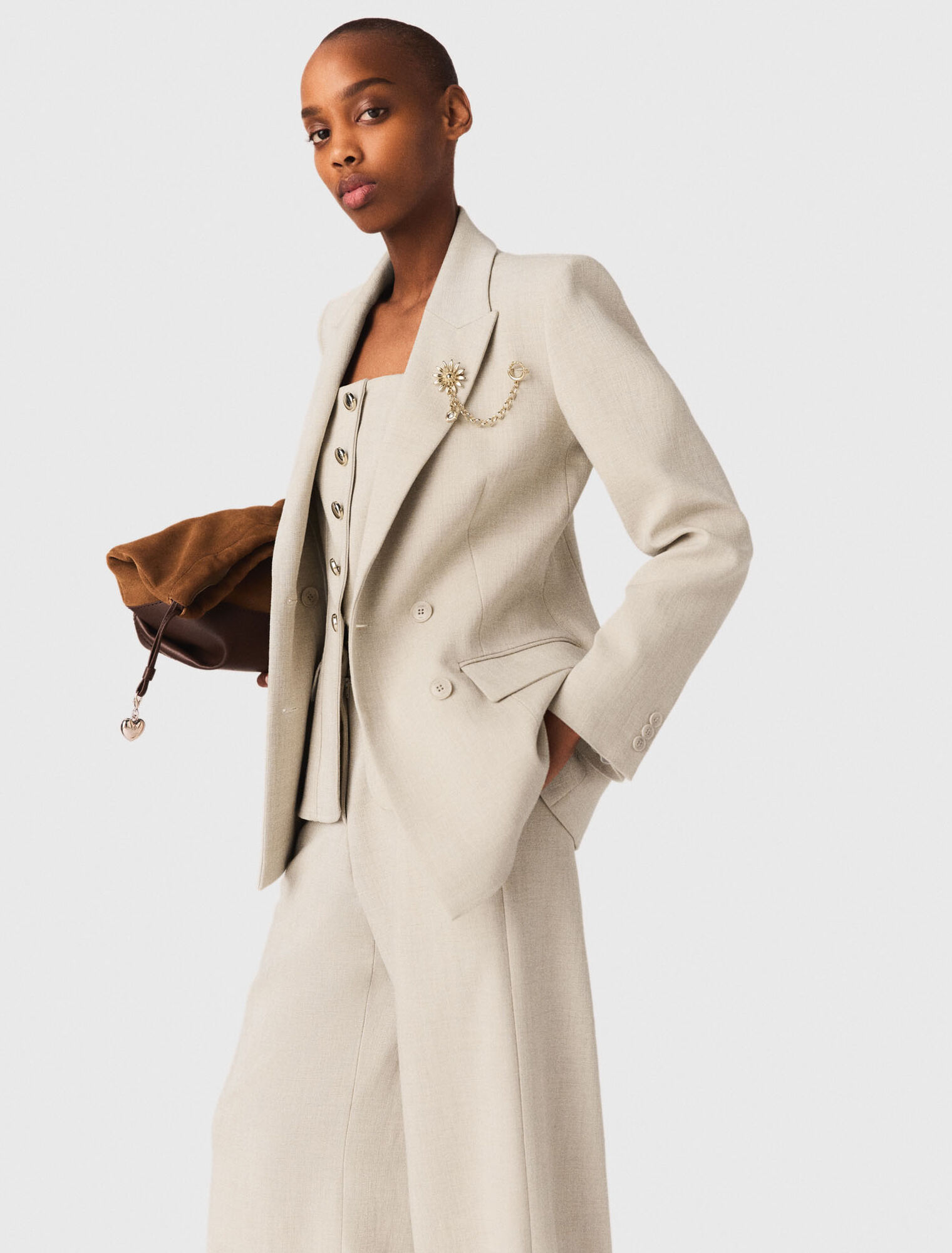 Suit jacket with brooch