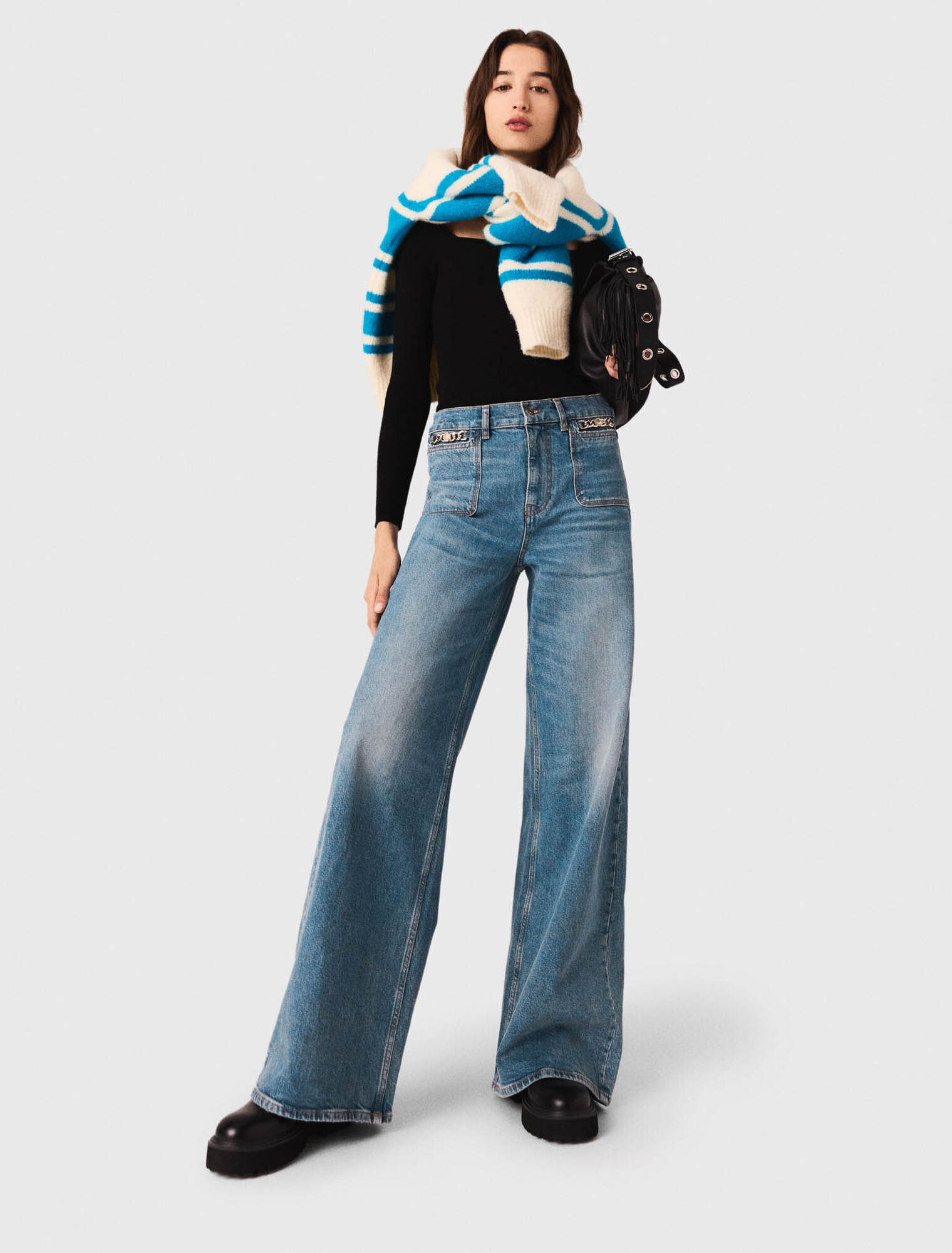 Flared jeans with chain