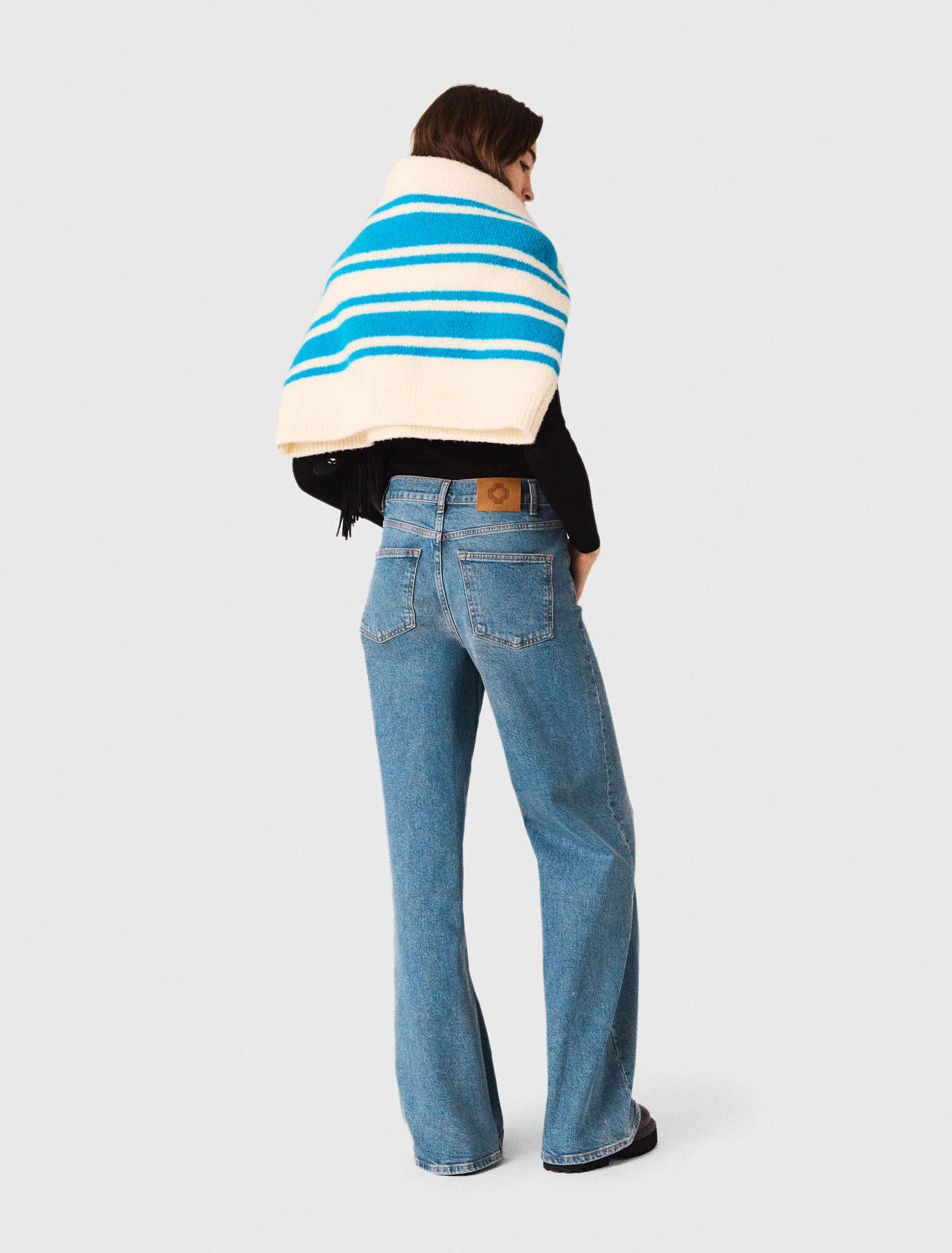 Flared jeans with chain