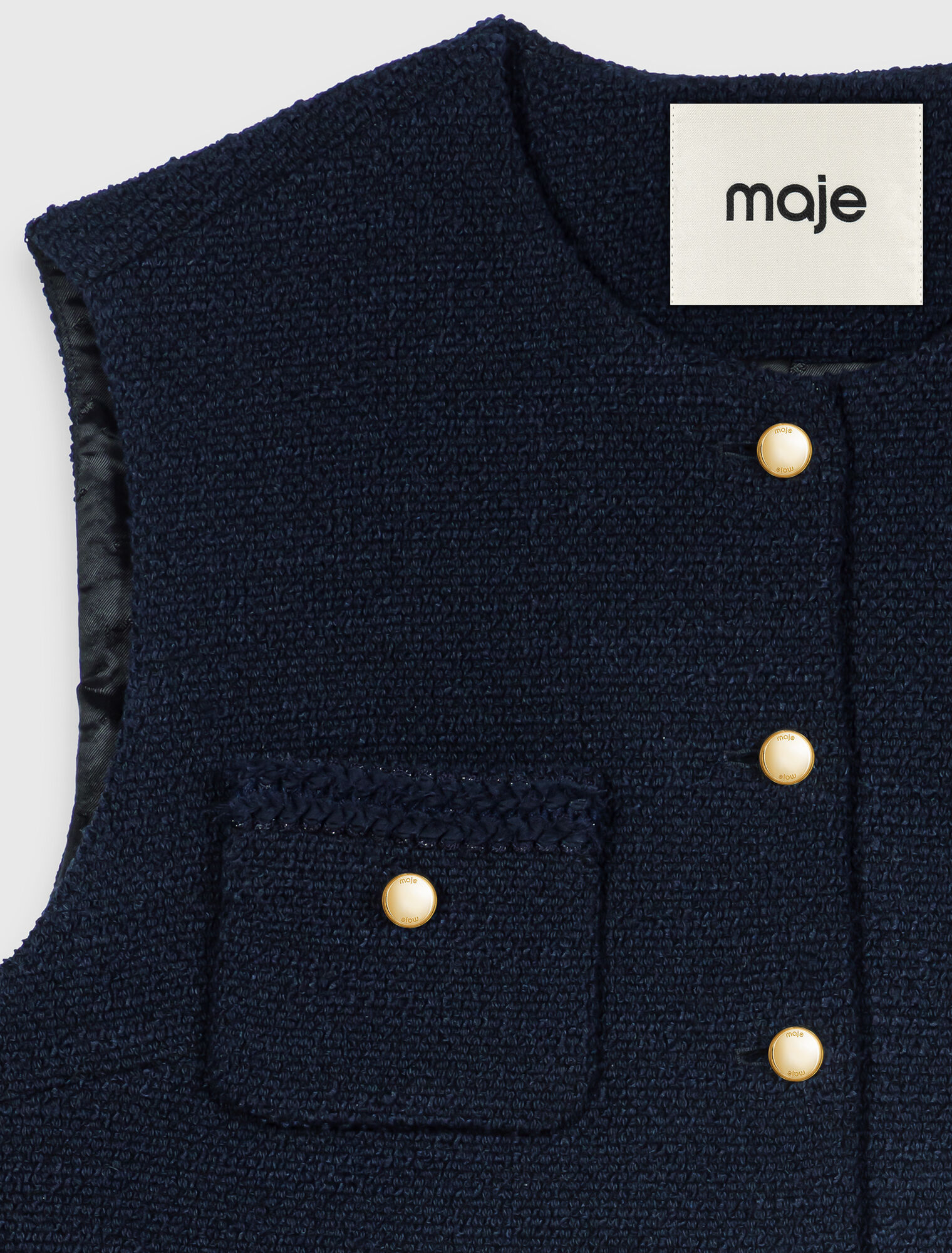 Sleeveless tweed jacket
